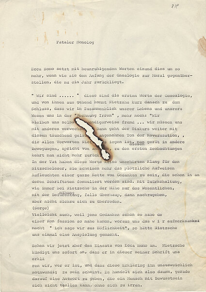 Getippter Text mit Brandloch