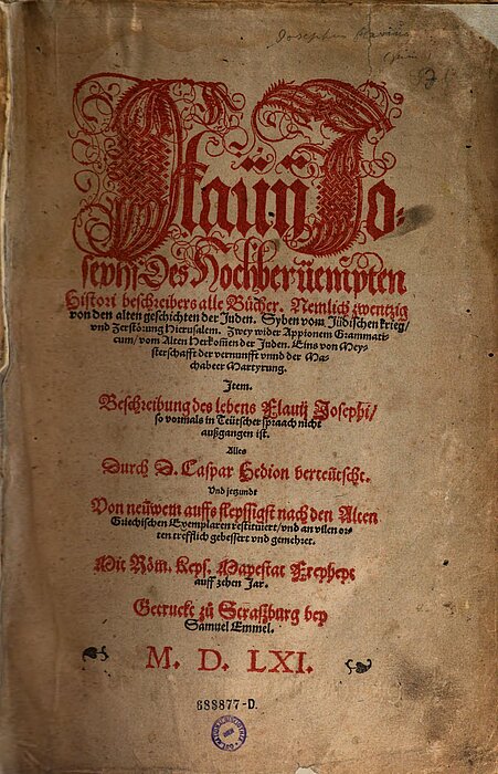 Altes Buch-Titelblatt mit roter und schwarzer Schrift, rot verziert.